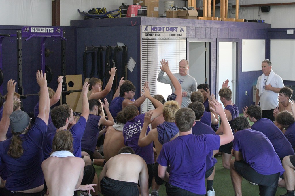 Head football coach Cary Rogers addresses players following a strength and conditioning session on Aug. 6. All photos: Paul Shepard