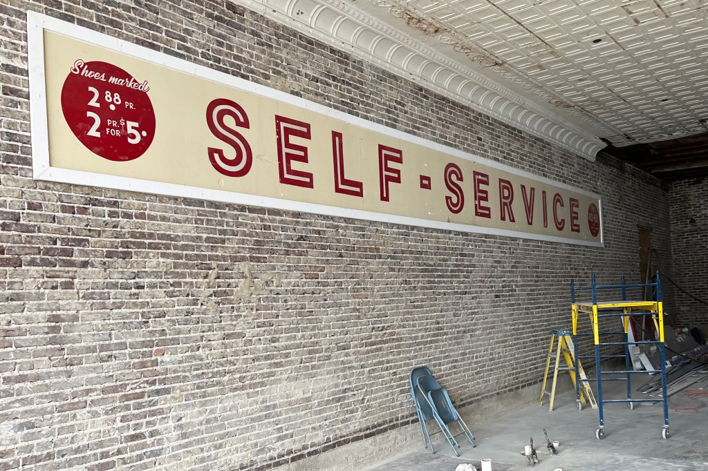 A sign hints at the building's past when it housed a shoe store. The sign has been cleaned and will be featured prominently Tasha Harris' new story. All photos: Michael Hibblen