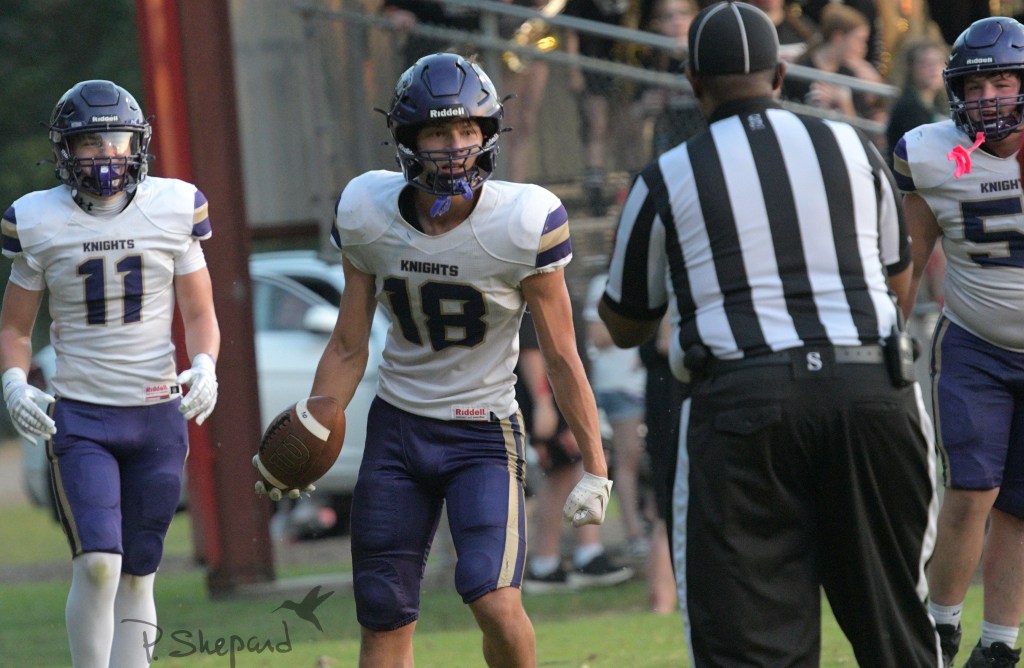 Running back Ely Welch scores a second quarter touchdown on a 6-yard run and Centerpoint to help the Knights to a 8-0 halftime lead. All photos: Paul Shepard