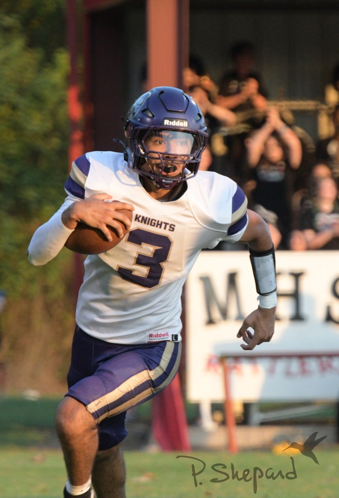 Centerpoint quarterback Tony Valdez goes around the right end for a long run during the first quarter.