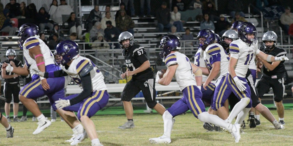 Running back Levi Wright follows blockers on way to a 25-yard touchdown run late in the second quarter.
