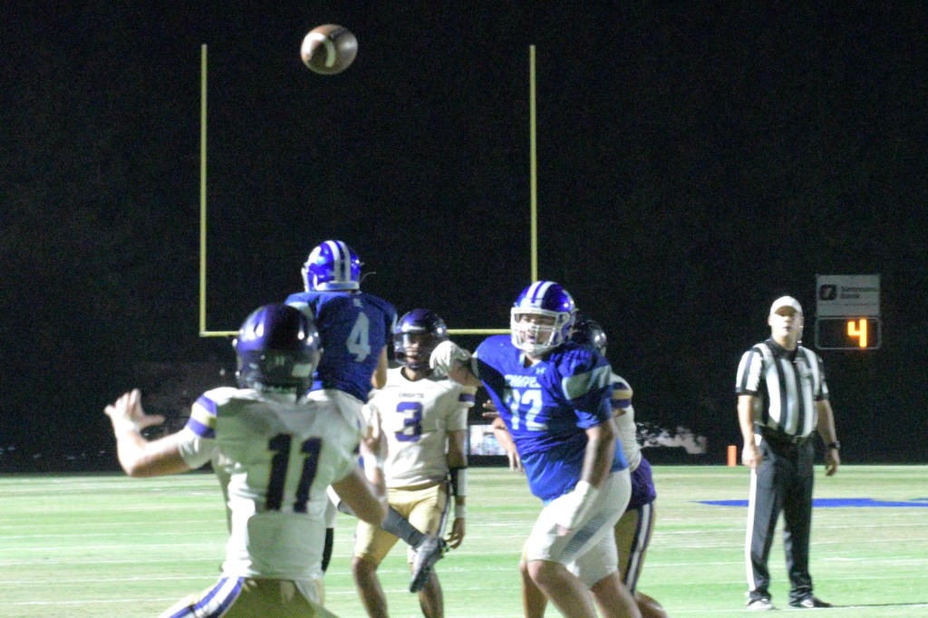 Centerpoint quarterback Tony Valdez tosses a touchdown pass to tight end Carson Cook early in the second quarter to extend the Knights' lead to 20-8. All photos: Paul Shepard