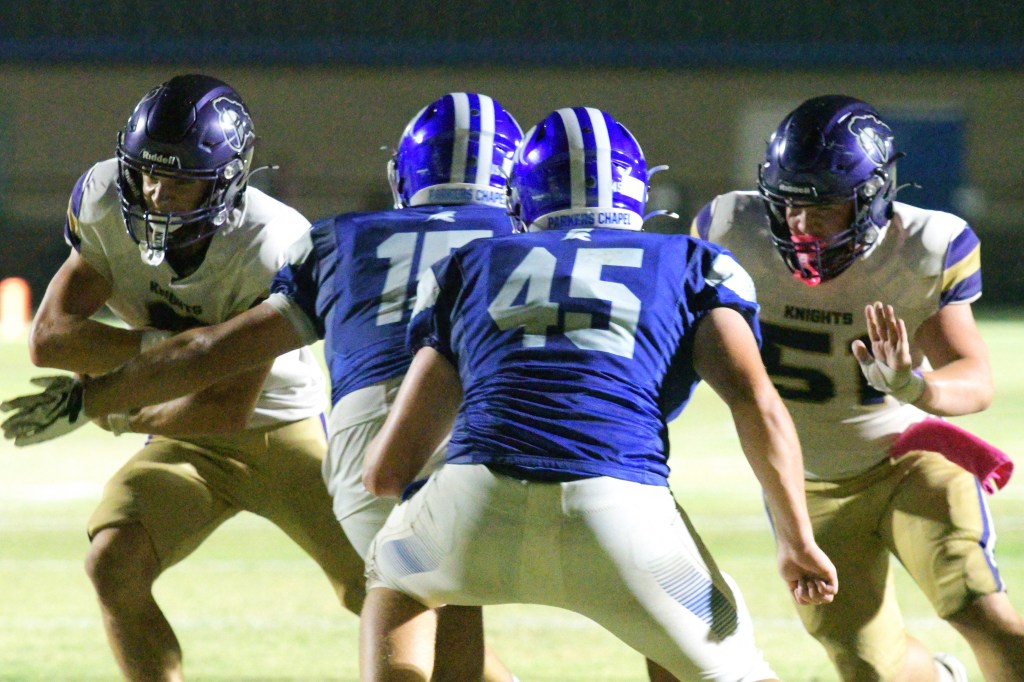 Running back Braxton Martin, left, runs for a touchdown on the first play of the final period to extend Centerpoint's lead to 40-14. Zaiden Allen, right, was blocking on the play.